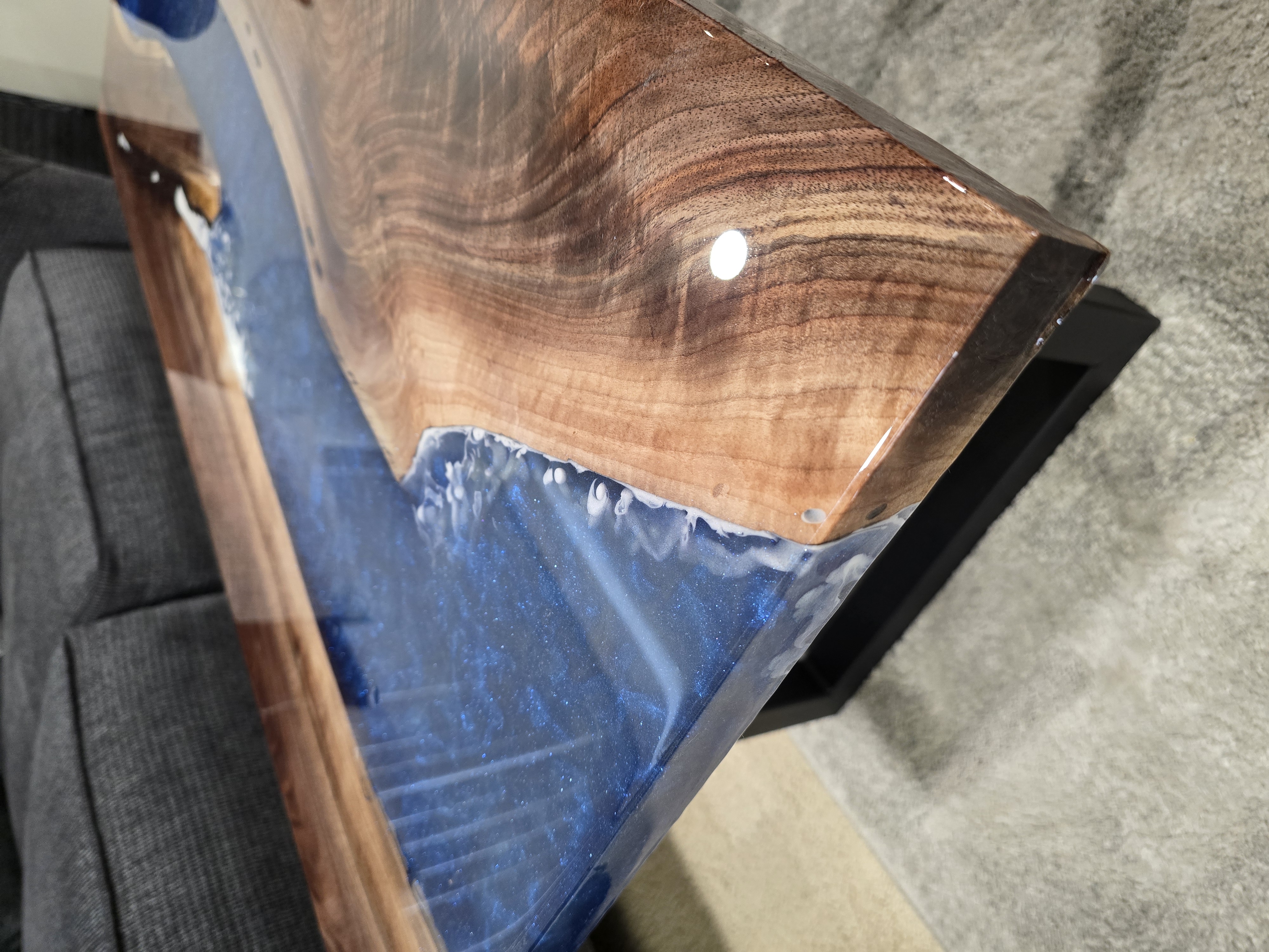 Custom epoxy resin coffee table with skull artwork and steel base